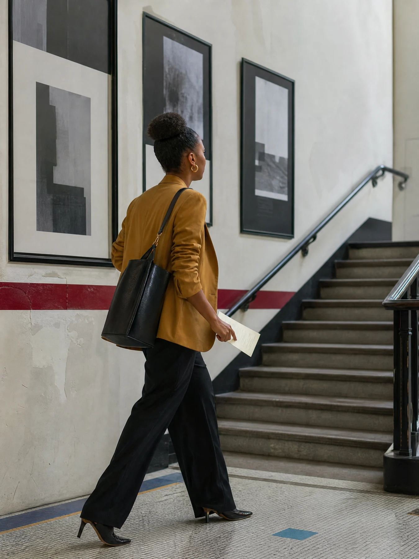 Professional arriving at a civic workshop staircase